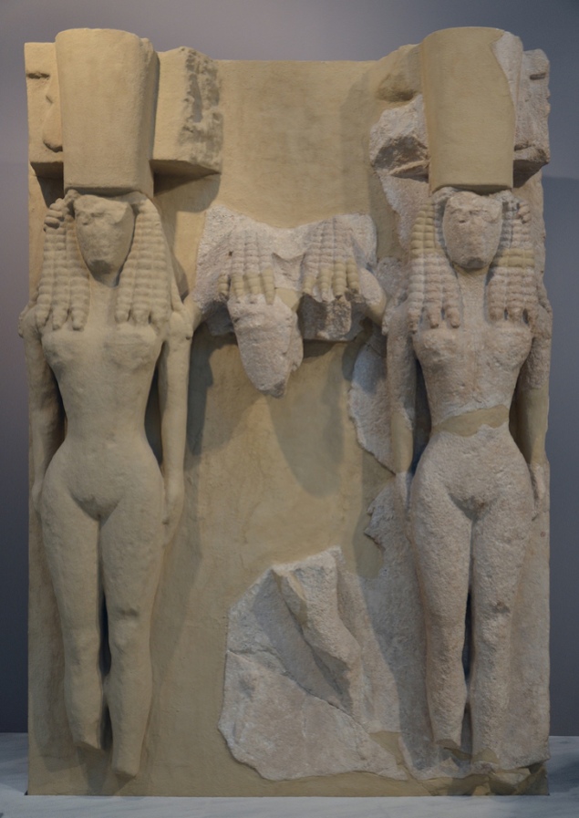 Large relief plaque of poros stone depicting naked Goddesses wearing the polos crown, from the Archaic Temple of Athena in Gortyna, mid-7th century BC.